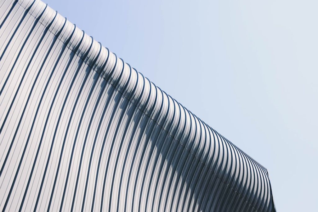 gray-and-white-building-roof-at-day-time-uun-2ixjva